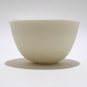 Viewed from the side, a Very Fine White Porcelain bowl in a rounded shape, only glazed on inside, with the outside unglazed and available in Woburn Mosaic, contemporary art gallery