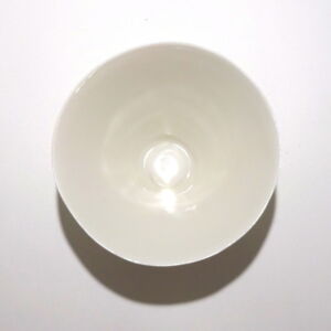 Viewed from above, a very fine white conical porcelain bowl, glazed on the inside with outside unglazed, available in Woburn Mosaic, contemporary art gallery