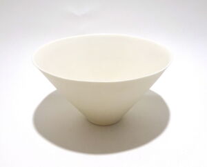 Viewed from a slight angle above, a very fine white conical porcelain bowl, glazed on the inside with outside unglazed, available in Woburn Mosaic, contemporary art gallery