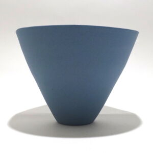 Viewed from the side, a very fine medium grey conical porcelain bowl, glazed on the inside with outside unglazed, available in Woburn Mosaic, contemporary art gallery