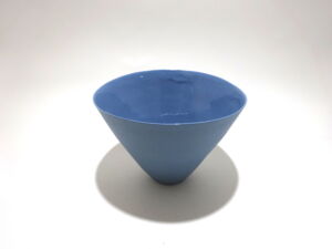 Viewed from a slight angle above, a very fine medium grey conical porcelain bowl, glazed on the inside with outside unglazed, available in Woburn Mosaic, contemporary art gallery