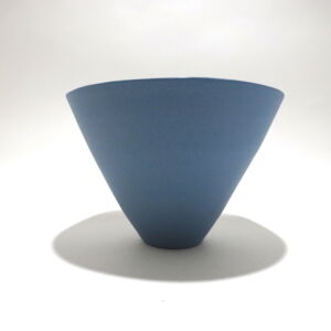 Viewed from the side, a very fine medium grey conical porcelain bowl, glazed on the inside with outside unglazed, available in Woburn Mosaic, contemporary art gallery