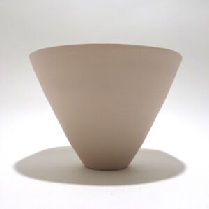 Viewed from the side, a very fine medium soft pink conical porcelain bowl, glazed on the inside with outside unglazed, available in Woburn Mosaic, contemporary art gallery