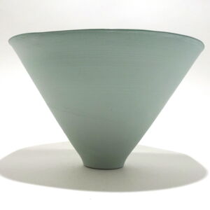 Viewed from the side, a very fine large green conical earthenware bowl, glazed on the inside with outside unglazed, available in Woburn Mosaic, contemporary art gallery