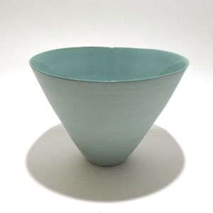 Viewed from a slight angle above, a very fine medium, green conical earthenware bowl, glazed on the inside with outside unglazed, available in Woburn Mosaic, contemporary art gallery
