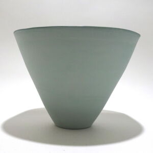 Viewed from the side, a very fine medium, green conical earthenware bowl, glazed on the inside with outside unglazed, available in Woburn Mosaic, contemporary art gallery
