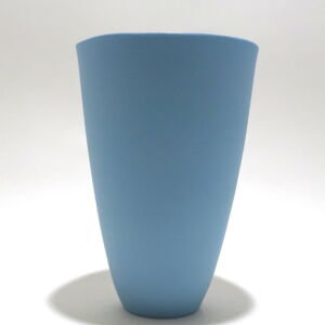 Viewed from the side, a very fine , tall turquoise porcelain tumbler, glazed on the inside with outside unglazed, available in Woburn Mosaic, contemporary art gallery
