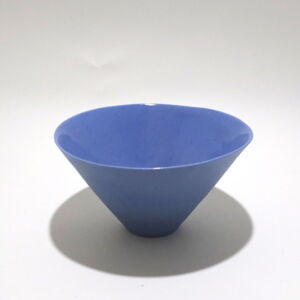 Viewed from a slight angle above, a very fine , small, lavender conical porcelain bowl, glazed on the inside with outside unglazed, available in Woburn Mosaic, contemporary art gallery