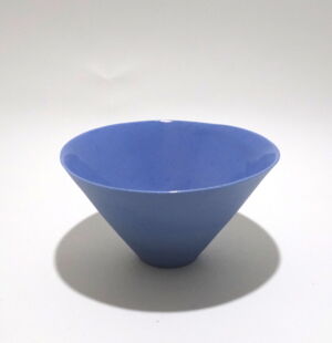 Viewed from a slight angle above, a very fine , small, lavender conical porcelain bowl, glazed on the inside with outside unglazed, available in Woburn Mosaic, contemporary art gallery